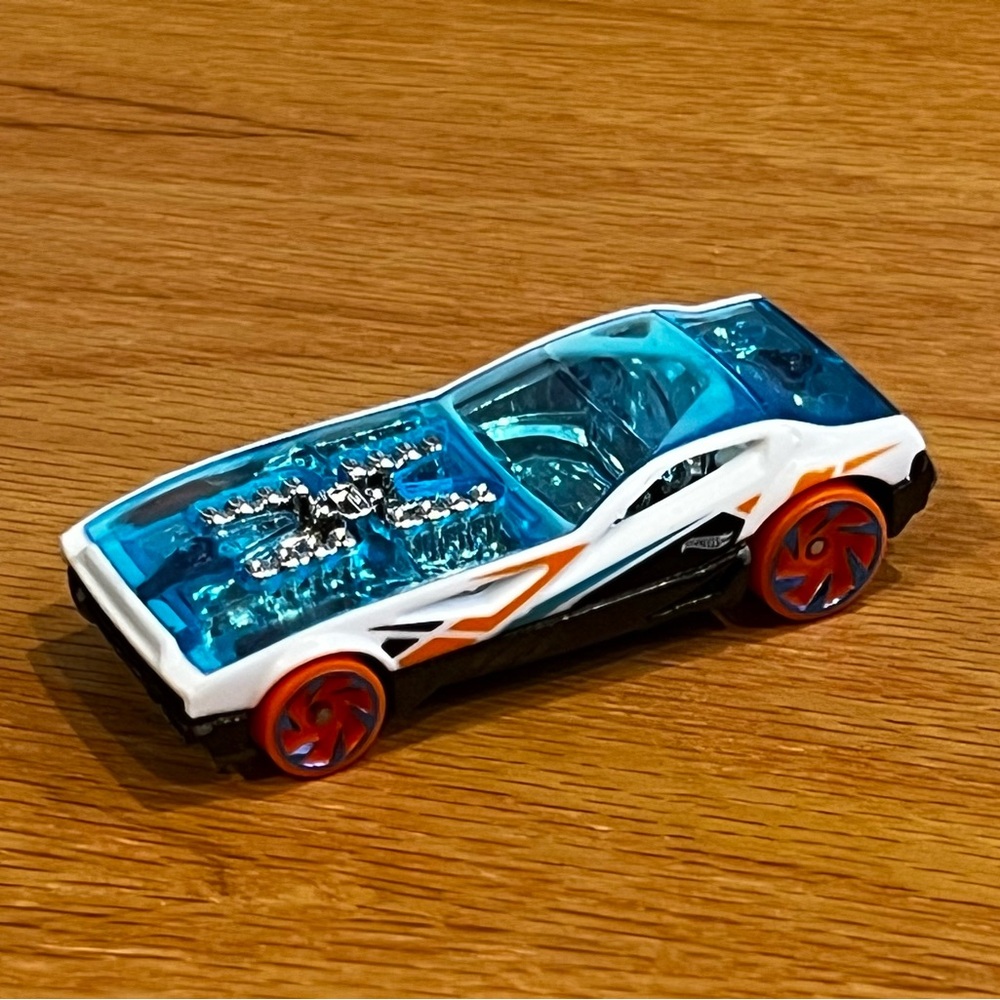 Blue and White Toy Car with Red Wheels